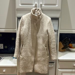 H&M knee length coat with silver zippers.